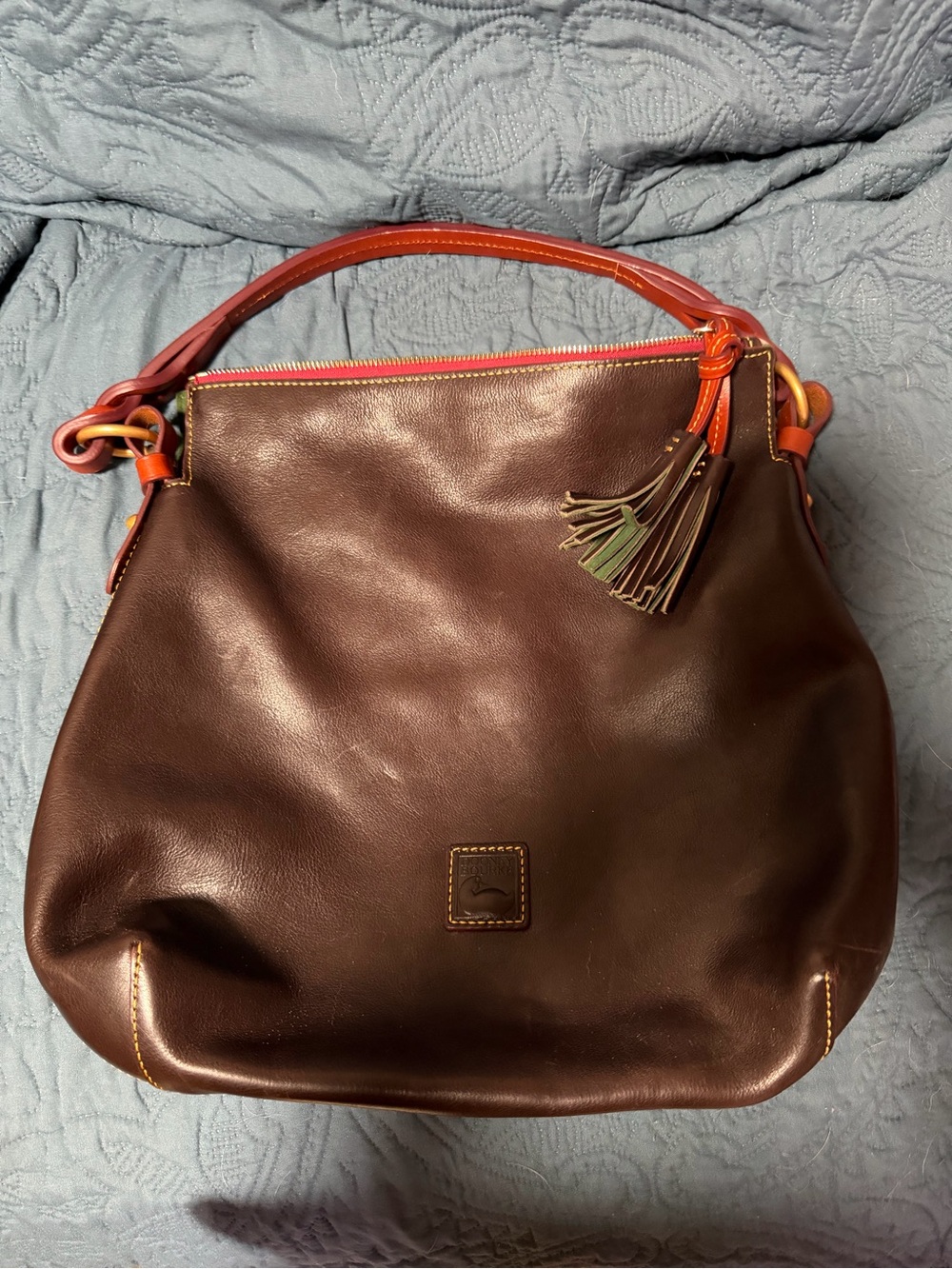 Dooney & Bourke Dark Brown Leather Hobo with Orange Trim and Multicolor Tassel
